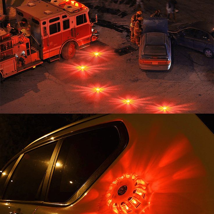 Emergency vehicle accident scene with red LED flares on the road for safety and visibility at night.