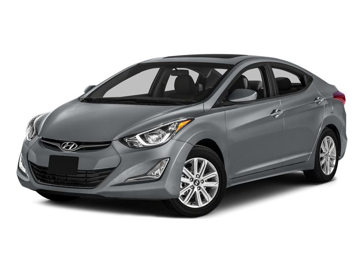 Gray Hyundai Elantra sedan with sleek design, featuring alloy wheels and stylish headlights, shown in a studio setting.