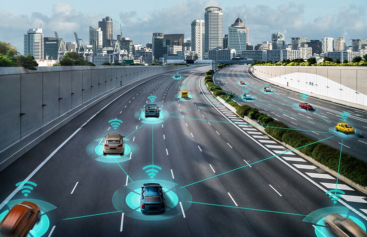 Futuristic city highway scene showing connected self-driving cars communicating through wireless signals for autonomous navigation.