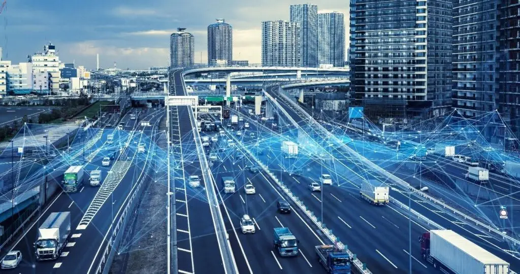 Implementing-smarter-rides - Engine Stories Futuristic smart city highway with network connections and traffic flow, showcasing urban technology and transportation systems.