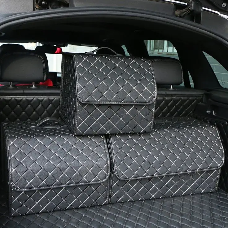 Portable Storage Organizer - Black-Small - Engine Stories Luxury black quilted storage boxes in a car trunk, enhancing organization and style. Perfect for efficient car accessories storage.
