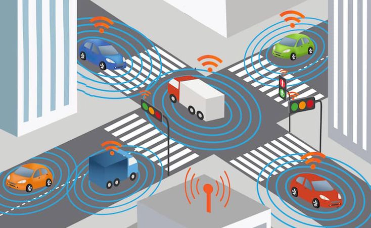 Illustration of connected vehicles at a city intersection, showcasing smart traffic management with wireless communication signals.