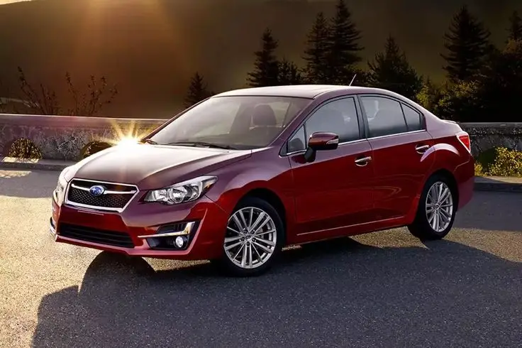 d73cae5d-10cf-4db8-8cfb-fa42c8ca9c76 - Engine Stories Red sedan car parked on scenic road, illuminated by sunset, with trees in the background; stylish and modern design.