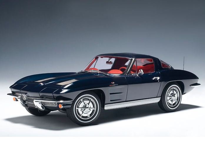 1963-Chevrolet-Corvette Sting Ray - Engine Stories Classic black vintage car with sleek design and red interior, showcasing iconic style and timeless elegance.