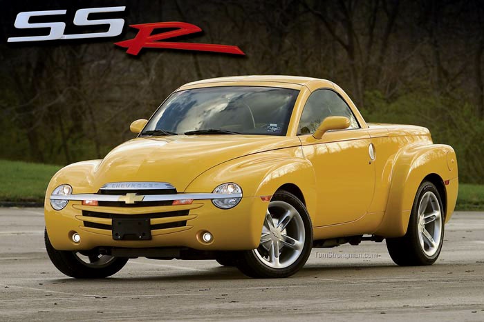 2003 Chevrolet ssr - Engine Stories Yellow Chevrolet SSR parked outdoors with logo on top left, showcasing its unique retro design and sporty curves.