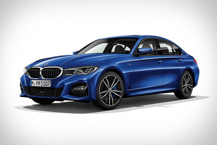 2019 BMW 3-Series Sedan - Engine Stories Blue sports sedan parked in a studio setting, showcasing sleek design and modern styling.