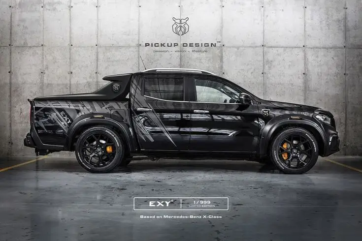 Customized black Mercedes-Benz X-Class pickup truck, side view, in an industrial setting. Luxurious and limited edition design.