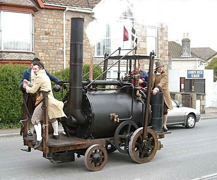 On Christmas Eve 1801 the Puffing Devil a - Engine Stories Vintage steam-powered vehicle with people in historical clothing on a street, demonstrating early transportation technology.