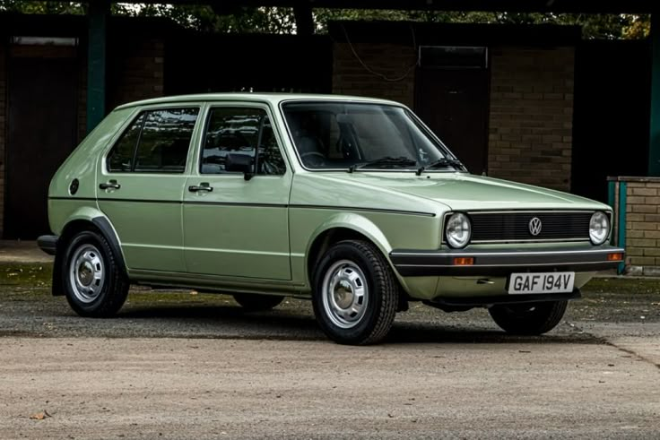 Vintage green Volkswagen Golf parked outdoors, showcasing classic design and mint condition. Ideal for car enthusiasts and collectors.