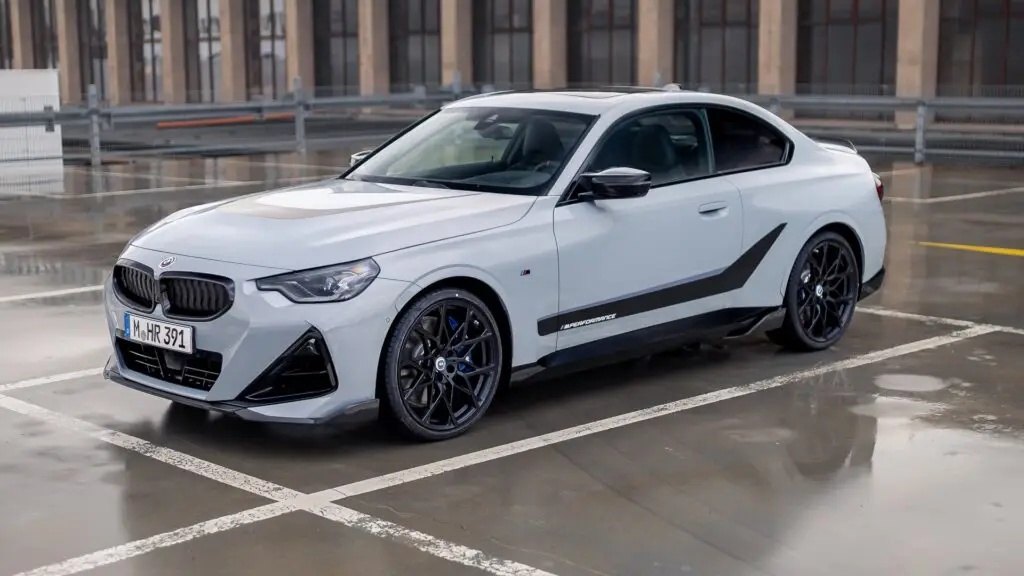 bmw_m240i_xdrive_coupe_m_performance_parts_4k-1920x1080 - Engine Stories Sporty grey BMW parked in an urban setting, showcasing sleek design and modern performance. Ideal for car enthusiasts.