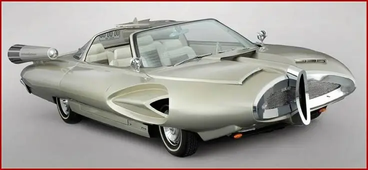 Ford X2000 1957 - Engine Stories Futuristic vintage concept car with sleek design, showcasing innovative aerodynamics and unique metallic details.