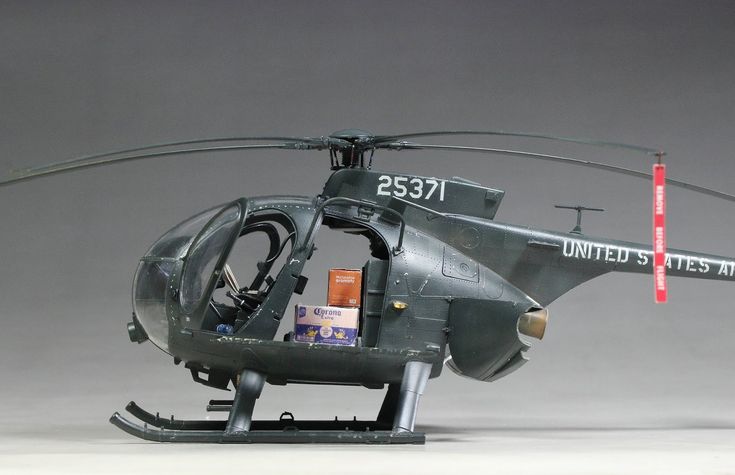 Kitty Hawk - Engine Stories Model military helicopter with beer cartons inside, showcasing unique cargo load.