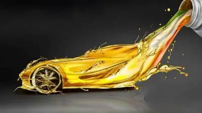 A creative car design made from flowing motor oil, symbolizing performance and protection in automotive engines.