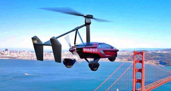 PAL-V - Engine Stories Flying car gyroplane over San Francisco Bay near Golden Gate Bridge on a clear day.