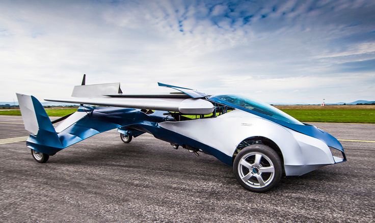 collapsible aeromobil 2_5 flying car successfully takes off - Engine Stories Futuristic flying car on runway, showcasing innovative design with retractable wings under a clear blue sky.