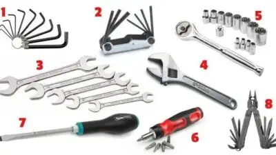 Assorted hand tools set including wrenches, hex keys, screwdriver, socket set, adjustable wrench, and multi-tool. Ideal for repairs.