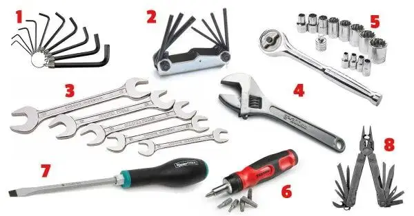 Assorted hand tools set including wrenches, hex keys, screwdriver, socket set, adjustable wrench, and multi-tool. Ideal for repairs.