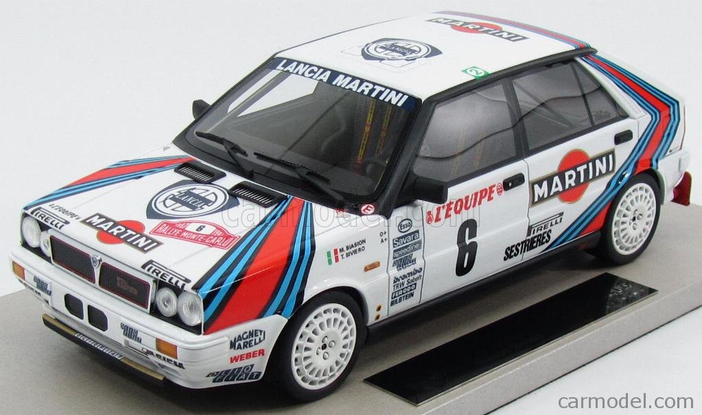 Model of a classic Lancia Delta Integrale rally car in Martini Racing livery, showcasing detailed decals and vibrant colors.