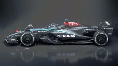 Sleek black and silver Formula 1 race car with prominent Petronas branding, showcasing aerodynamic design and sponsors.