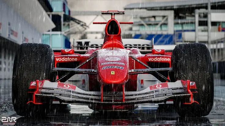 Red Formula 1 car in the rain on a track, showcasing aerodynamic design and wet tires for optimal performance.