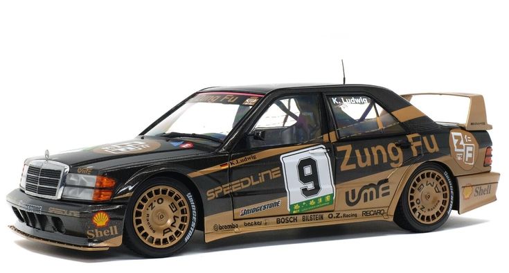 Race car with number 9, black and gold livery, featuring logos of Zung Fu, Speedline, and Shell, side view.