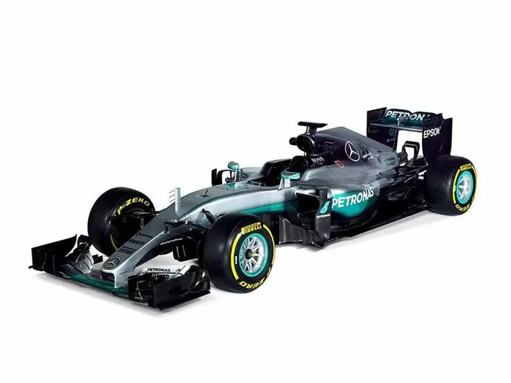 Silver and black Formula 1 race car with sponsor logos and aerodynamic design, isolated on white background.