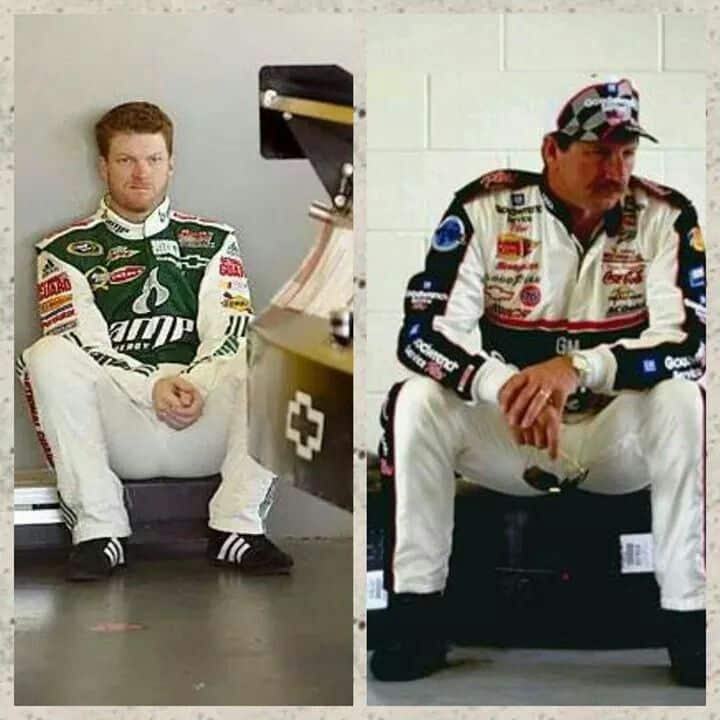 Two racecar drivers in full gear sitting side by side, reflecting on a race moment, showcasing intense focus and determination.