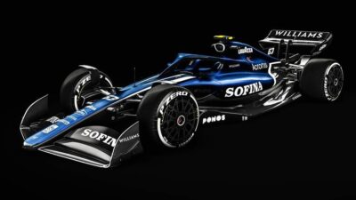 Dark blue Williams F1 car on a black background, showcasing sleek design and prominent sponsor logos.