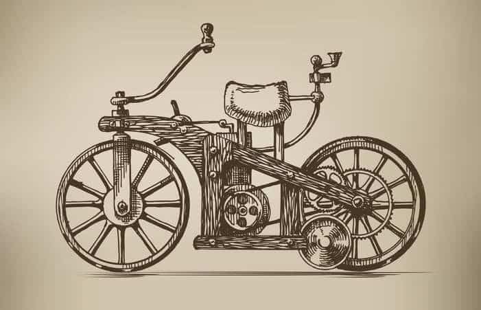 Vintage sketch of an early motorcycle design, showcasing intricate gears, wheels, and handlebars on a sepia-toned background.
