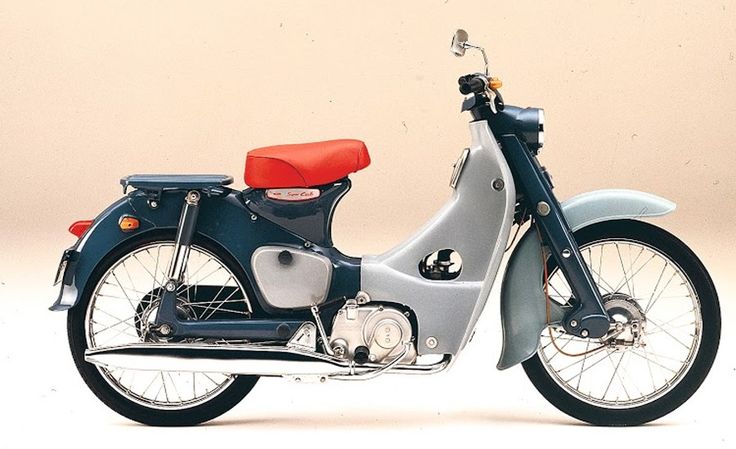 Classic vintage moped with red seat, blue and silver body, side view on a plain background. Retro motorcycle design.