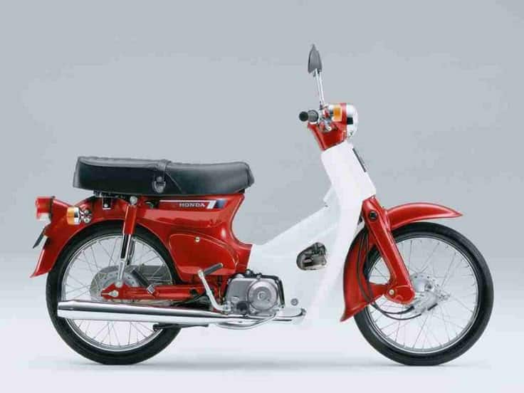 Classic red and white moped with a sleek design, perfect for city commuting and vintage enthusiasts.